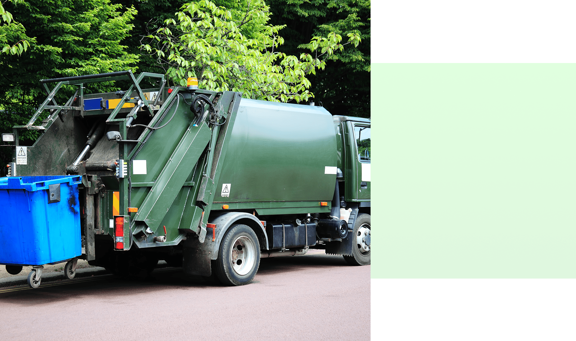 Group 1321315767 Garbage truck collecting blue recycling bin.